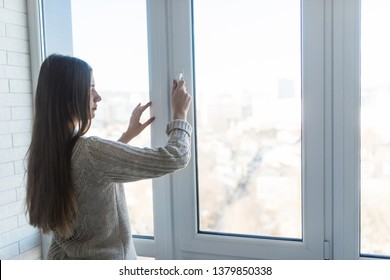 Beautiful Woman Opening Window In The Morning