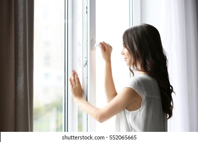 Beautiful Woman Opening Window In The Morning