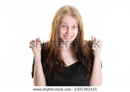 beautiful woman over isolated white background celebrating a victory hands up