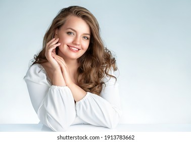 Beautiful Woman With Perfect Makeup On Light Blue Background. Beauty And Skin Care Concept. Plus Size Model.