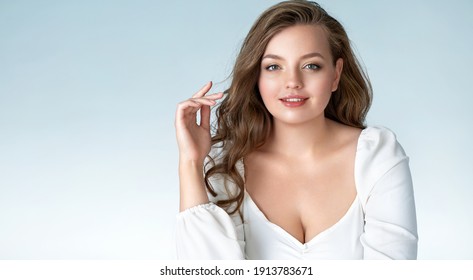 Beautiful Woman With Perfect Makeup On Light Blue Background. Beauty And Skin Care Concept. Plus Size Model.