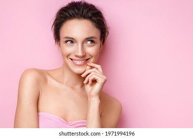 Beautiful Woman With Perfect Skin On Pink Background. Beauty And Skin Care Concept