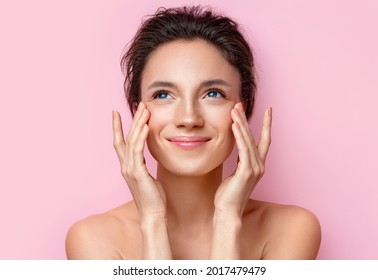 Beautiful woman with perfect skin on pink background. Beauty and skin care concept - Shutterstock ID 2017479479