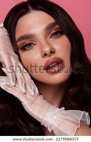 Beautiful woman with perfect skin on pink background. Beauty and skin care concept.