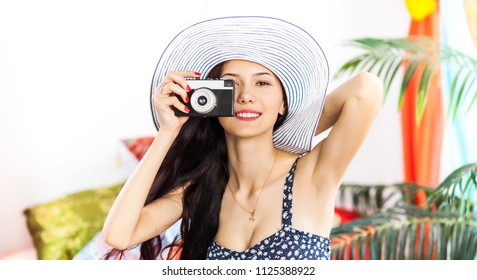 Beautiful woman Photographer making pictures with retro hipster camera having fun at the vacation. Summer lifestyle - Powered by Shutterstock