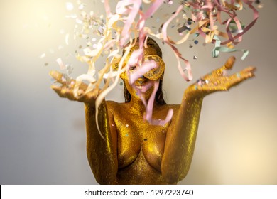 Beautiful woman playing confetti. Celebration, event or carnival concept. Movement and happiness having fun. Brazilian Carnaval.