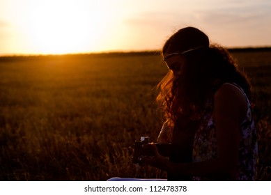 Beautiful Woman Playing Gitar On The Field