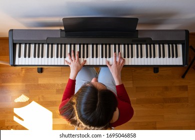 Beautiful Woman Playing Piano At Home