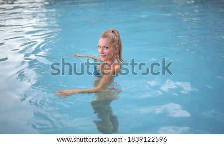 beautiful woman in a pool