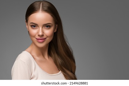 Beautiful woman portrait with curly long healthy. Hair beauty natural casual style Gray background - Shutterstock ID 2149628881