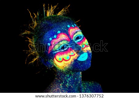 The  beautiful woman portrait face, aliens fooling around, ultraviolet make-up. 