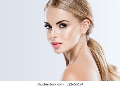 Beautiful woman portrait with fresh daily make-up blonde hair and healthy skin