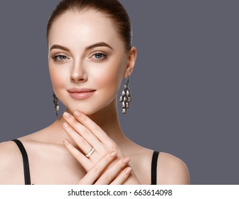 Beautiful Woman Portrait with Perfect makeup Hairstyle. Fashion Model jewelry over color background. Studio shot. - Shutterstock ID 663614098