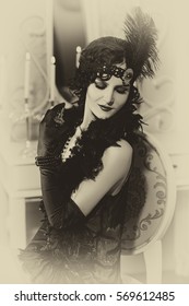 Beautiful  woman, portrait in retro  style .  Old photo. Vintage toning.