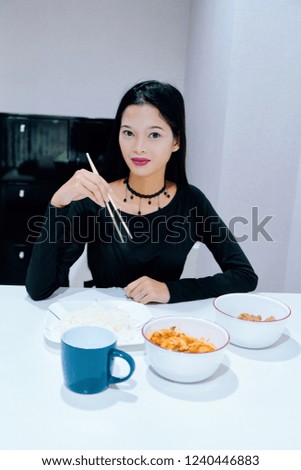 Beautiful woman posing - eating, sitting, smiling face