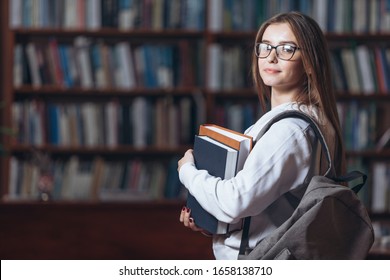 Beautiful woman posing on camera at public library - Powered by Shutterstock