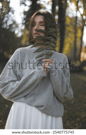 Similar – Image, Stock Photo Blonde girl with hat and hands in the head enjoying relaxed the nature in forest.