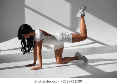 Beautiful woman practicing sports, classes in yoga studio. fit figure, acrobatics stretching - Powered by Shutterstock