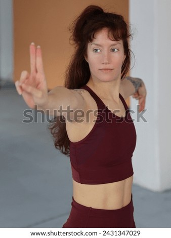 Beautiful woman practicing Yoga, or Tai Chi, Tai Ji Chuan, and Qi gong. Sport muscular body, prefect stomach abs muscles