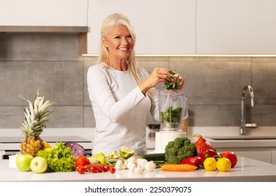 Beautiful woman preparing healthy and delicious food in a modern kitchen 
 - Powered by Shutterstock