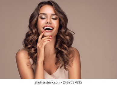 Beautiful woman in profile  with long  and   shiny wavy  hair .  Beauty  model girl with curly hairstyle .  Presenting your product. Expressive facial expressions