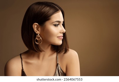 Beautiful Woman Profile Portrait with Golden Earring Bob Hair Style over dark Brown. Beauty Model Face with perfect Nose and Full Lips Make up side view. Sexy Girl Glamour Portrait