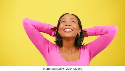 Beautiful woman puts arms behind head, relaxation stretch, yellow studio - Shutterstock ID 2364727699