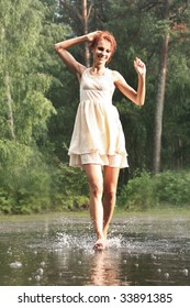 Beautiful Woman In The Rain Without An Umbrella