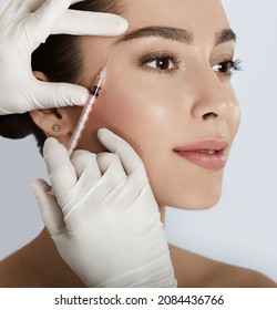 Beautiful Woman Receives Anti Wrinkle Beauty Injection For Facial Rejuvenation And Wrinkle Removal. Facial Mesotherapy, Eye Wrinkle Injection