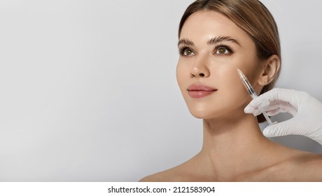 Beautiful Woman Receives Anti Wrinkle Beauty Injection For Facial Rejuvenation And Wrinkle Removal. Facial Mesotherapy, Eye Wrinkle Injection