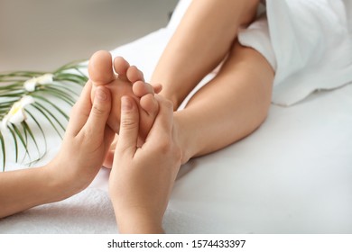 Beautiful Woman Receiving Foot Massage In Spa Salon