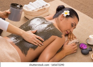 Beautiful Woman Receiving A Mud Therapy