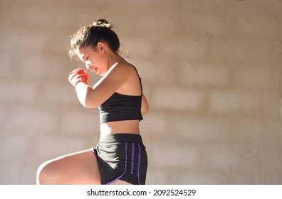 Beautiful Woman with the Red Boxing Gloves. Attractive Female Boxer Training. - Powered by Shutterstock