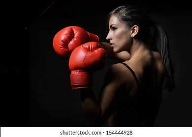 Beautiful Woman With The Red Boxing Gloves,black Background