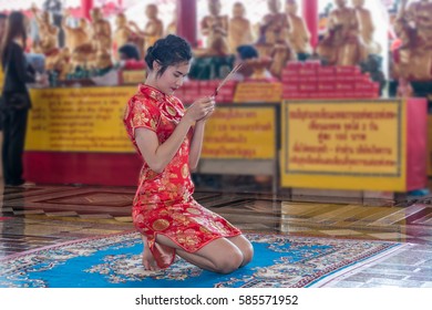 Beautiful Woman In Red Chinese Suit Make Merit Pay Respect To Buddha