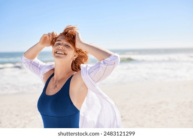 Beautiful woman with red hair and freckles having fun in blue swimsuit on tropical beach, with copy space. Curvy young woman smiling and looking at camera at sea. Joyful girl in swimwear enjoying. - Powered by Shutterstock