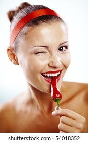 Beautiful Woman With Red Lips Holding Chilli Pepper