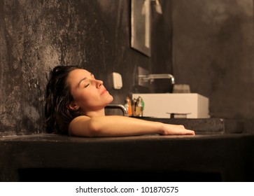 Beautiful woman relaxing in a bathtub - Powered by Shutterstock