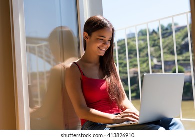 Beautiful Woman Relaxing With A Computer 