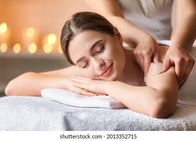 Beautiful woman relaxing and having massage in a SPA. - Shutterstock ID 2013352715