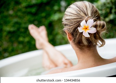 Beautiful woman relaxing at home and taking a bath - Powered by Shutterstock