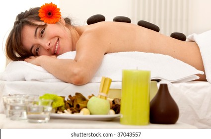 Beautiful woman relaxing at a spa smiling