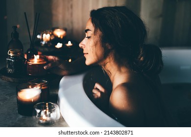 Beautiful woman relaxing at spa. Young lady relaxing in jacuzzi.  - Powered by Shutterstock