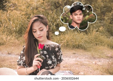 A beautiful woman remembers her boyfriend while smelling a rose. Missing and longing her man.Outdoor scene. - Shutterstock ID 2036502644