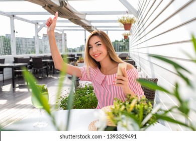 Beautiful Woman Restaurant Dress, Girl Summer Cafe. Waving Hand, Giving Lead Friends, Greets Guests, Asks Bill Lunch Dinner Breakfast. Long Hair Everyday Makeup. Happy Smiling Resting After Work.