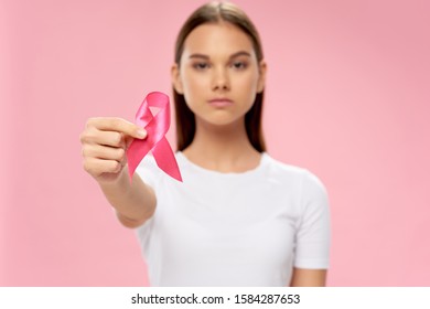 Beautiful woman with a ribbon in her hands charity work health help and support - Shutterstock ID 1584287653