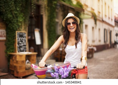 Beautiful woman riding on bike