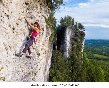 Beautiful Woman Rock Climbing In Ontario, Canada.