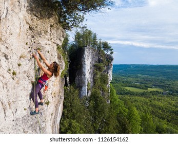 Beautiful Woman Rock Climbing In Ontario, Canada.