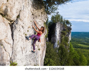 Beautiful Woman Rock Climbing In Ontario, Canada.